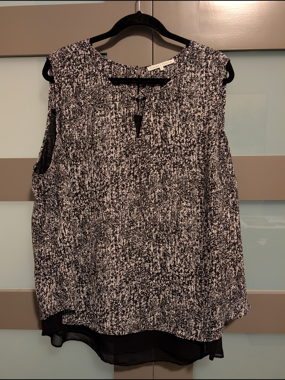 Violet & Claire Black and White Sleeveless Blouse with Layered Hem